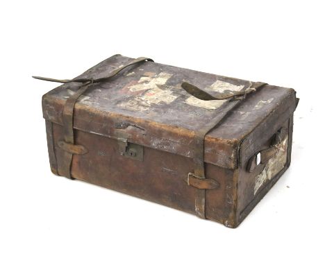 Vintage leather trunk and contents. Trunk has two leather straps and handles at either end. Plus a quantity of assorted linen