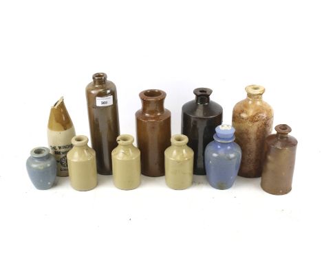 A collection of eleven assorted vintage stoneware bottles. Including The Winchester Brewery Co. Ltd. beer bottle (AF), etc. M