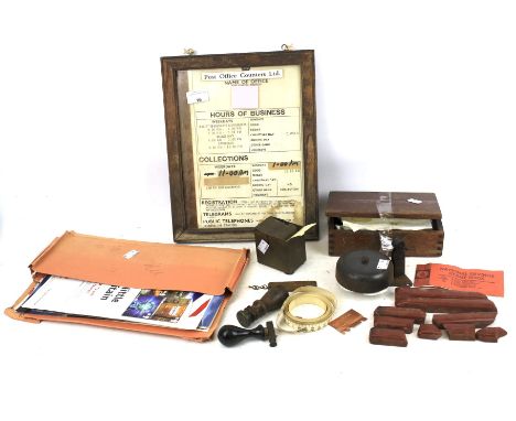 An assortment of vintage Post Office collectables.  Including a seal stamp, shop door bell, stamp advertising ephemera, etc.