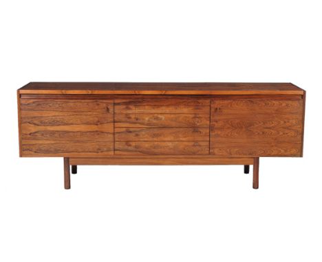 ϒRobert Heritage for Archie Shine, a rosewood sideboard, circa 1970, 77cm high, 213cm wide, 51cm deep; and Anon., a rosewood 