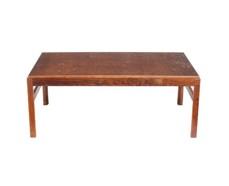 ϒA rosewood and embossed copper topped coffee table, third quarter 20th century, 49cm high, 77cm wide, 132cm deep Please note