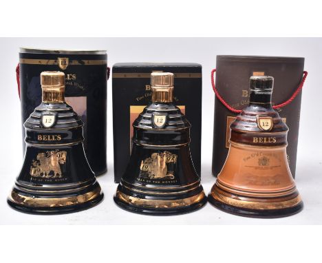 A collection of three Bell's Fine Old Scotch Whisky Wade porcelain decanters in original boxes. The lot to include a 1991 Yea