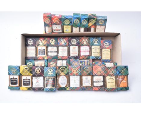 A collection of vintage boxed Scotch Whisky Tartan miniature collection bottles. The lot comprising of a The Macallan 10 year
