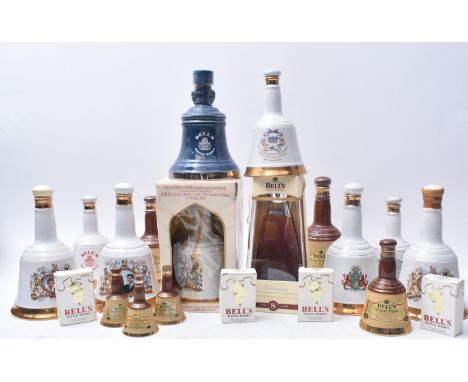 A collection of approximately fourteen Bell's Scotch Whisky Wade porcelain commemorative decanters. The lot comprising a comm