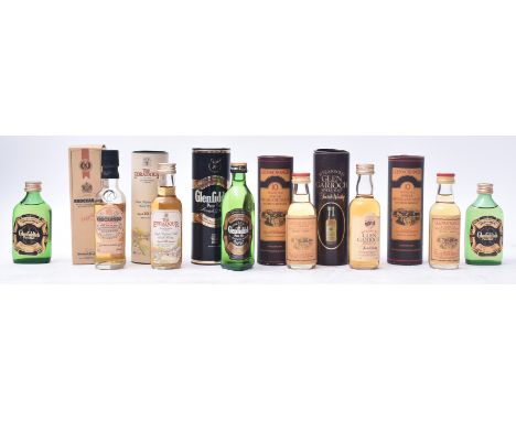 An assortment of vintage boxed &amp; unboxed single &amp; pure malt scotch whiskies miniature bottles. The lot comprising of 
