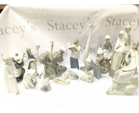 A collection of Lladro and Nao porcelain figures. This lot cannot be posted