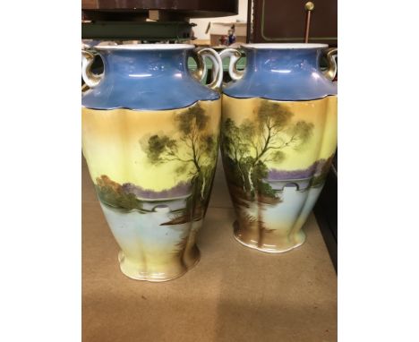 A pair of Noritake vases decorated with land scape views
