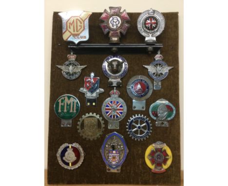 A mounted display of vintage car badges including some rare examples. Shipping category C.