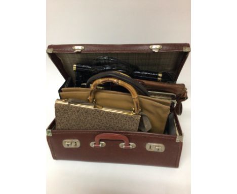 A collection of vintage ladies handbags and a small travelling case