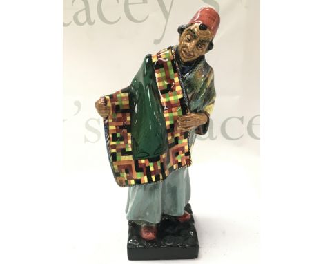 A Royal Doulton porcelain figure, Carpet Seller . 23cm tall