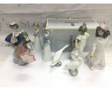 A collection of Lladro and Nao figures including one boxed example. Shipping category D.