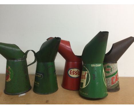 Five vintage oil jugs comprising Royal Snowdrift, Duckhams, Esso and other examples. Shipping category C.