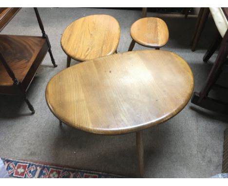 A nest of Ercol pebble tables. Tallest 40cm tall ,smallest 32cm tall.