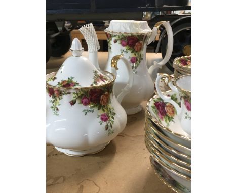 A collection of Royal Albert country rose including coffee/ tea pot dinner plates bowls cups saucers milk jug sugar bowl.