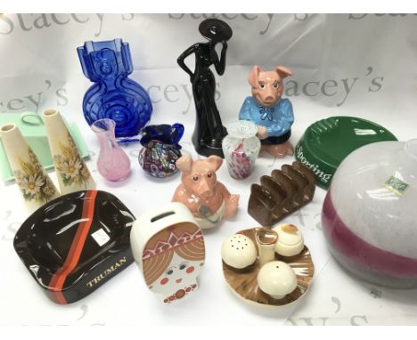A collection of ceramics including Wade pigs, Wade Truman and Sporting Life porcelain ashtrays, Purbeck swanage vases, Caithn
