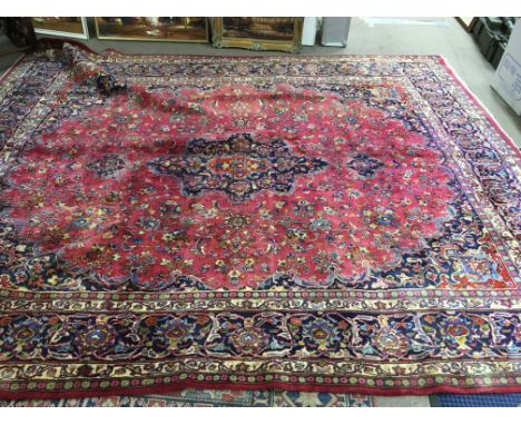 A large Middle East carpet. Approx 293cm wide 355cm long