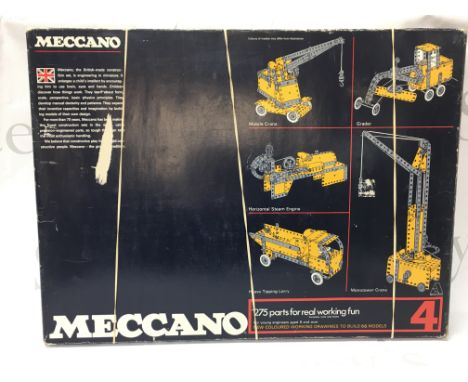A vintage boxed and complete Meccano 4 set with manuals , postage category C