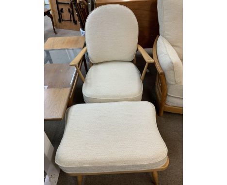 A pair of Ercol model 203 chairs and matching stools.