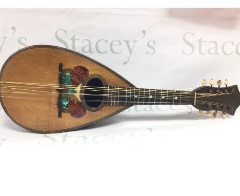 A mandolin with inlaid butterfly design. Postage category C. NO RESERVE