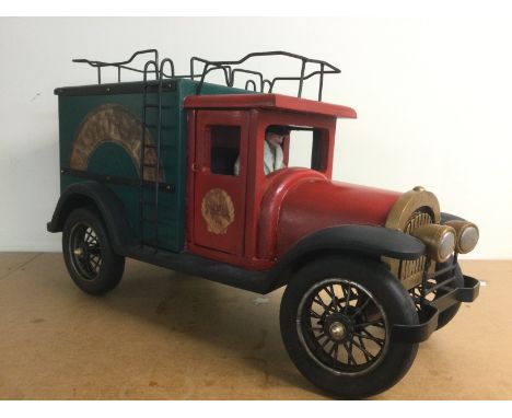 A scratch built painted wooden model of a vintage Shell van and driver, approx length 61cm. Shipping category D.