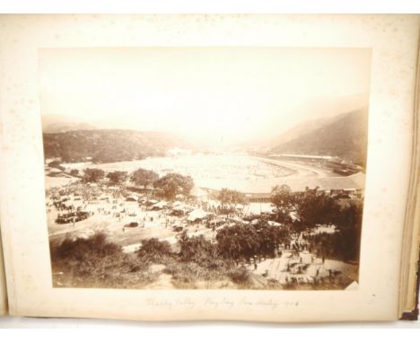 A photograph album circa 1900 relating to HMS Terrible containing 100+ mounted photographs of various places HMS Terrible ser