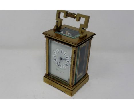 Brass carriage clock by Reid &amp; Sons Paris, working at lotting, H: 12 cm. P&amp;P Group 1 (£14+VAT for the first lot and £