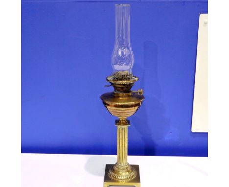 Brass paraffin lamp on a square base with chimney, H: 63 cm. Not available for in-house P&amp;P 