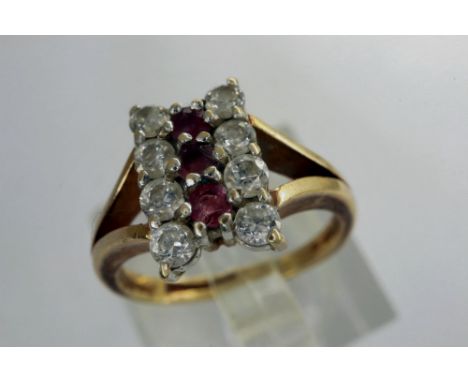 9ct gold Art Deco style dress ring set with three rubies flanked by two rows of diamonds, size H/I, 2.4g. P&amp;P Group 1 (£1