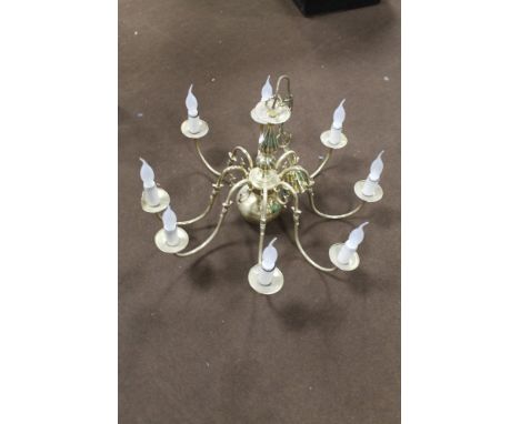 A BRASS CHANDELIER WITH DECORATIVE CANDLE STYLE LIGHT BULBS 