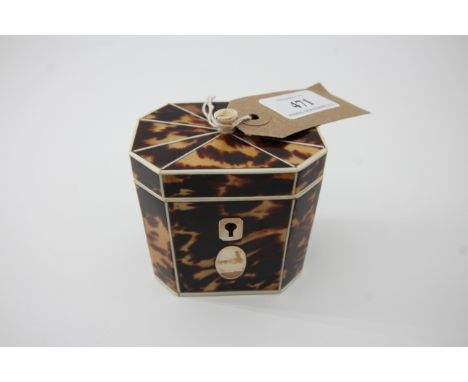 Delightful miniature tortoiseshell tea caddy inset with silver and having original silver foil lining measuring 3" high x 3" 