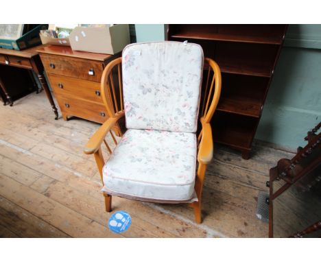 Ercol style easy chair with curved back, fabric seat and back of loose leaf design 