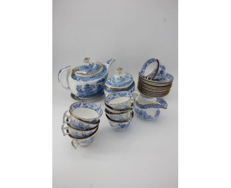 19th century part blue and white service including teapot, surrier, milk jug, 10 cups, saucers and a stand for a tea pot