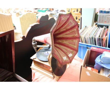 Antique record player complete with metal horn, appears to be working, with selection of 78 records