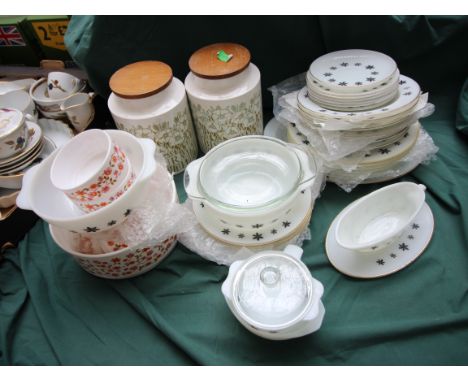 Collection of vintage pyrex style cookware, canisters, plates, oven ware and bowls