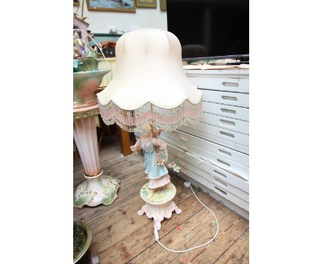 Large ornate china lamp with lady figurine and pink shade 