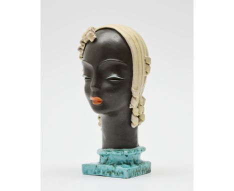 Goldscheider   Art deco bust, circa 1930  Glazed terracotta  Manufacturer's stamps to base and numbered '7604'  30cm high   C