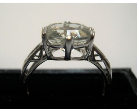 9ct white gold ring with large clear stone & 3 small diamonds to each shoulderApprox 2.7 grams gross            size O 