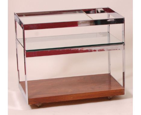 A 1960s Merrow Associates flat-sided chrome and rosewood tea trolley, the two upper tiers having glass insets over rosewood p