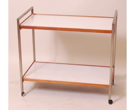 A 1960s Danish brushed aluminium, teak and white laminate inset two tier tea trolley, raised on roller casters, h.77cm, w.84c