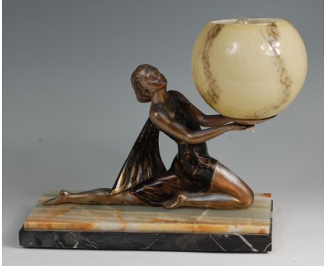 Salvatore Melani (Italian 1902-1934) - An Art Deco patinated spelter table lamp, having a two-tone globular glass shade held 