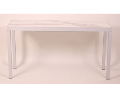 Phillipe Starck - An anodised metal and faux carrera marble inset writing table, with integral fitted light, h.71cm, w.135cm,
