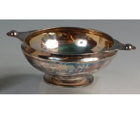 * A Scottish Art Nouveau silver twin handled pedestal bowl, by Hamilton & Inches, of circular tapering form, later inscribed 