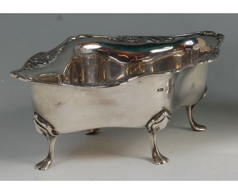 An Art Nouveau silver sweetmeat dish, of pinched and shaped form, with pierced floral stylised border, raised on hoof feet, b