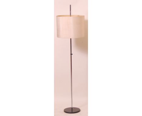 A 1980s German chrome and black enamelled metal standard lamp, having rise-and-fall action, with cream plastic three-light fi
