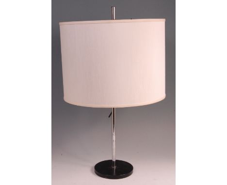 A 1980s German chrome and black enamelled metal table lamp, having a cream moulded plastic three light fitting with rise-and-