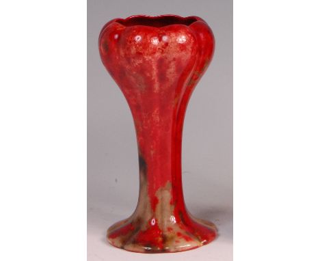 Charles Noke for Royal Doulton - An early 20th century flambé glazed ceramic vase, of tulip form, painted in heightened tones