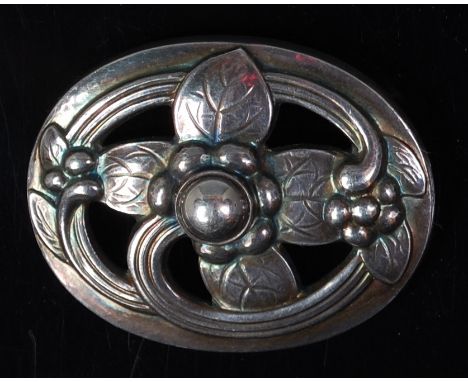 A Georg Jensen sterling silver pierced floral brooch, of oval form, impressed marks Georg Jensen Denmark 925 S verso, w.3.8cm