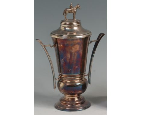 * A contemporary silver pedestal racing trophy cup and cover, in the Art Deco style, the cover with horse and jockey finial, 