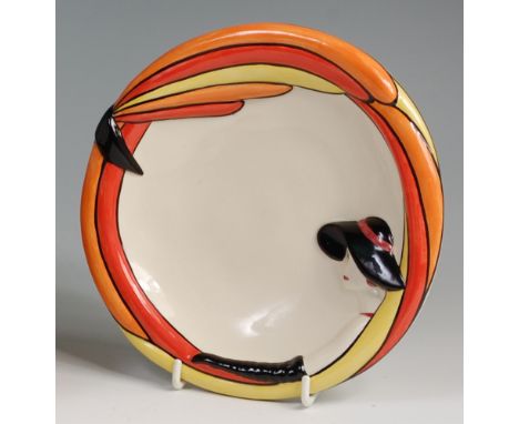 A Lorna Bailey painted and glazed circular pottery dish, having a raised profile portrait, with further bright coloured borde