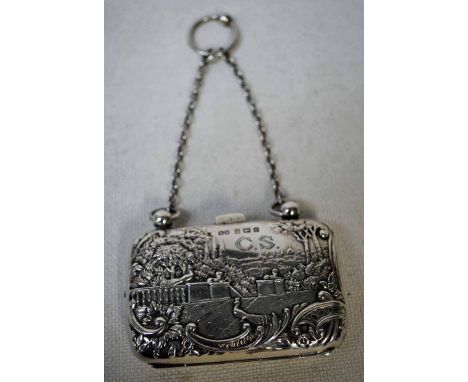 A late Victorian silver Ladies Purse, embossed both sides with landscape and figures in a garden, push relase, green silk int